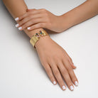 4311 - 14kt yellow gold hammered finish & shiny torched edges, multi-color tourmalines, and diamond cuff bracelet.