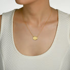 5184 - oval circle textured 14kt yellow gold, with shiny edges diamond necklace