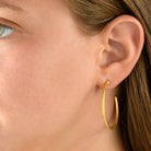 6328 - 14kt yellow hammered texture hoop earring