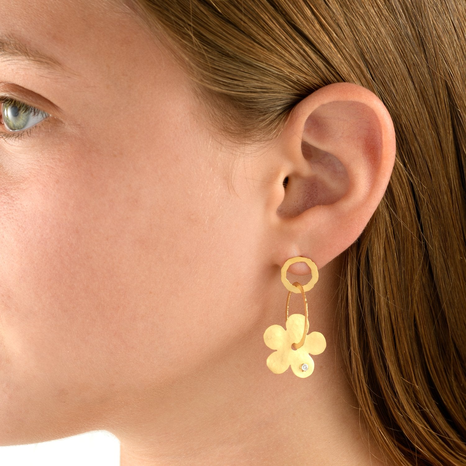 2409 - 14kt yellow gold dangling earring, textured matte finish with diamonds. post and friction back. 