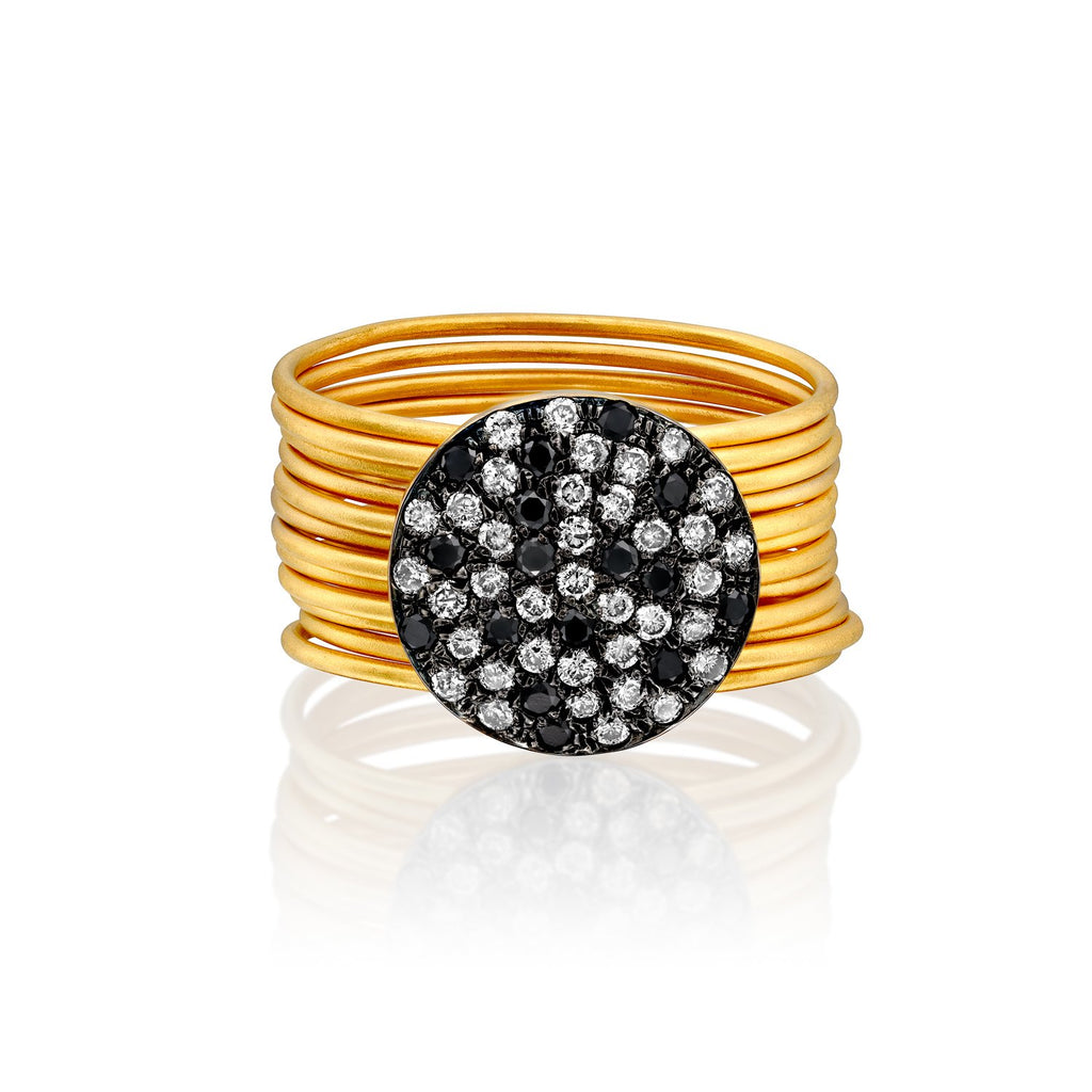 3710 - twelve stackable band rings in 14kt yellow gold matte satin finish. connected to a 12mm black & white diamond pave disc.