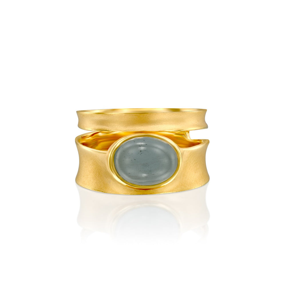 4845A - striking 14kt yellow gold band ring with natural cabochon aquamarine oval shape. matte satin finish with shiny edges.