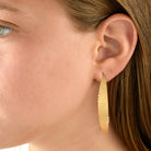6516 - 14kt yellow hammered gold hoop earring with white diamonds
