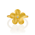 7320 - classic organic handmade flower ring in 14kt yellow satin-matte finish. the ring has a center 0.02cttw round brilliant cut white diamond in a bezel setting.