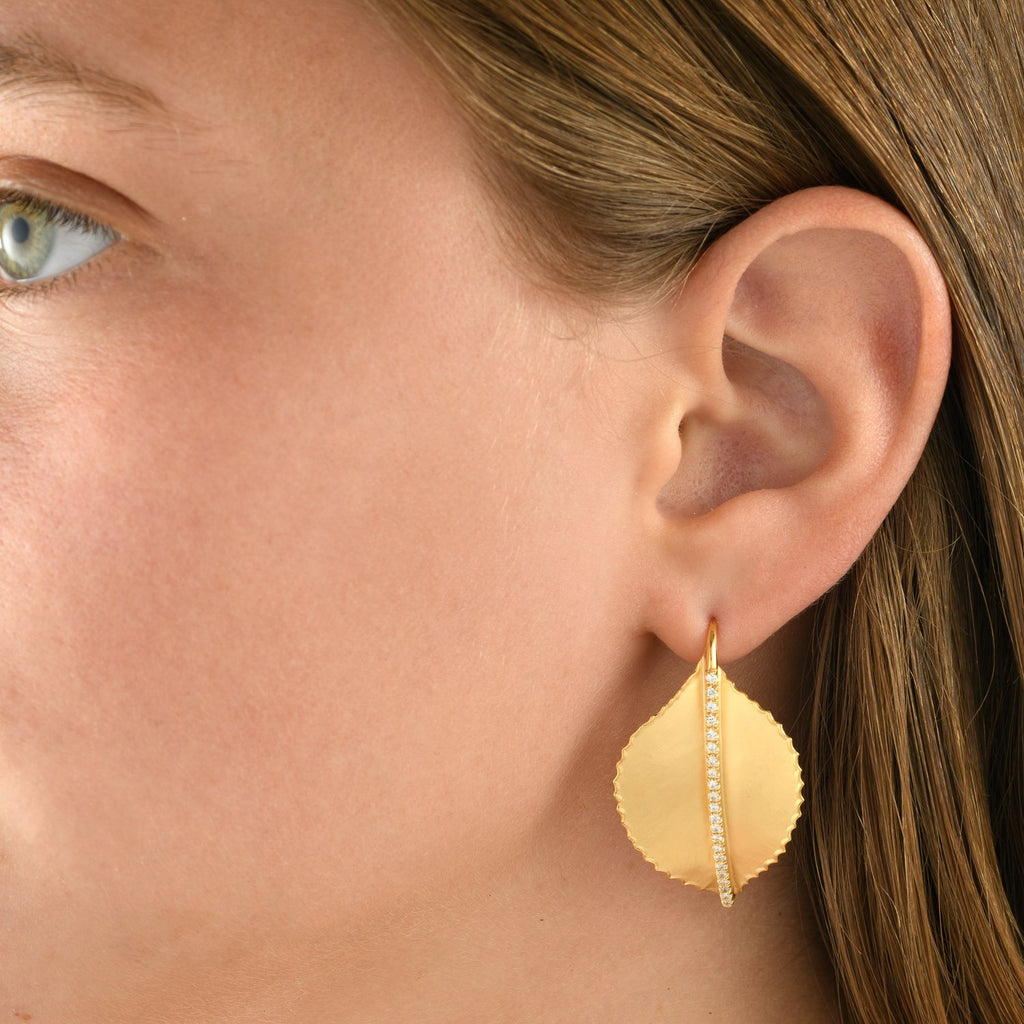 7368 - 14kt handmade detailed yellow gold leaf earring, unique matte finish with shiny torched edges and white diamonds on a short wire